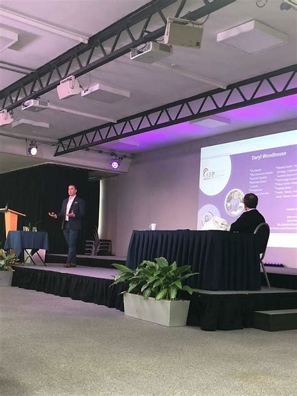 Daryl Woodhouse speaking on stage